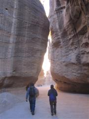 The walk starts through a path of massive rocks on either side