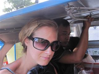 Me crammed on a trike en route to the hostel with SIX other passengers and the driver!