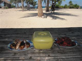 Barbecued fish (eyeballs included) and chicken for lunch