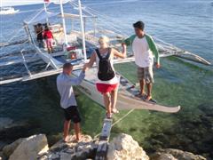 This is how I had to get on the boat with my backpacks